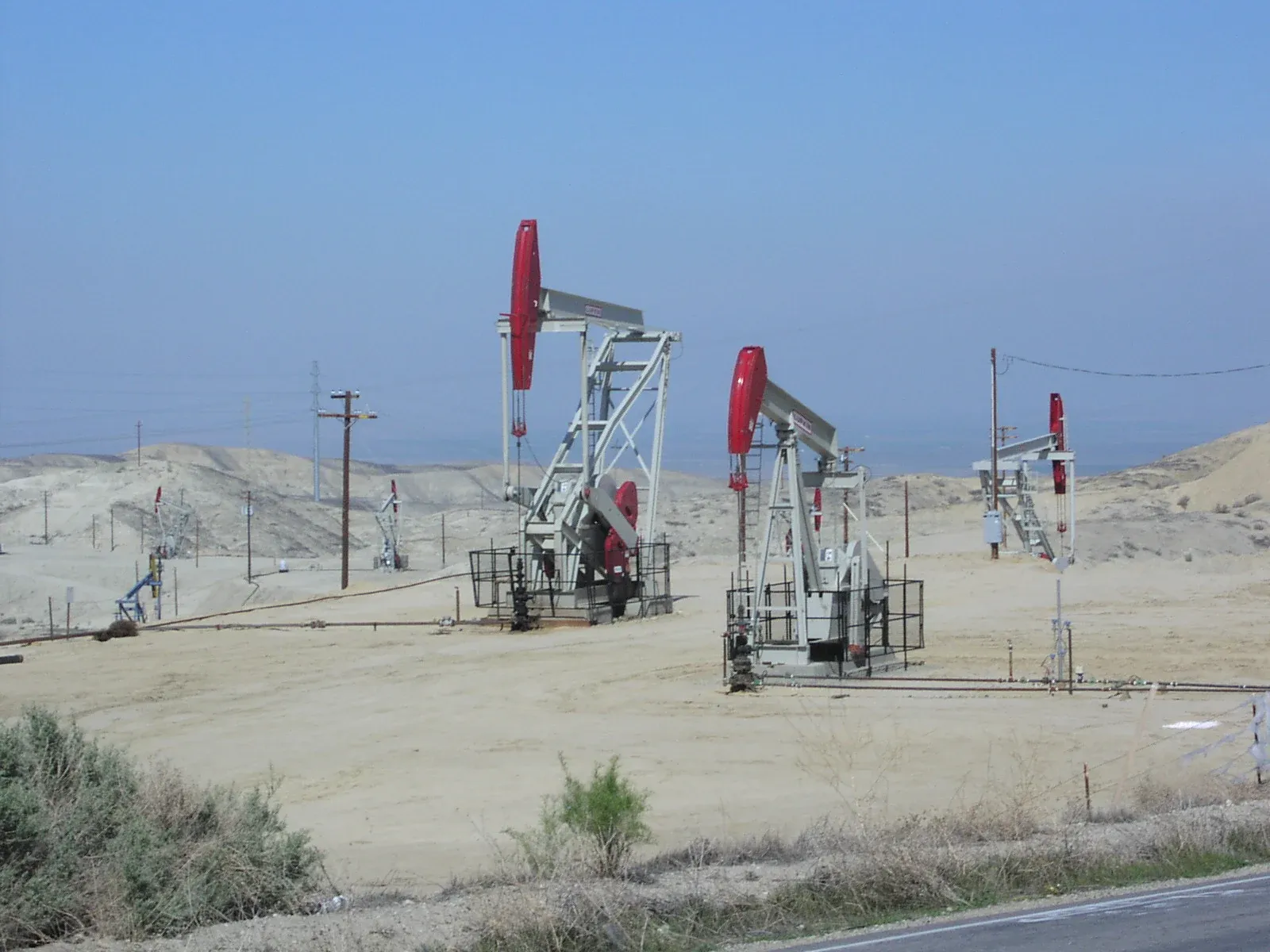 Three active oil wells in Elk Hills Oil Field, south of Buttonwillow, California.