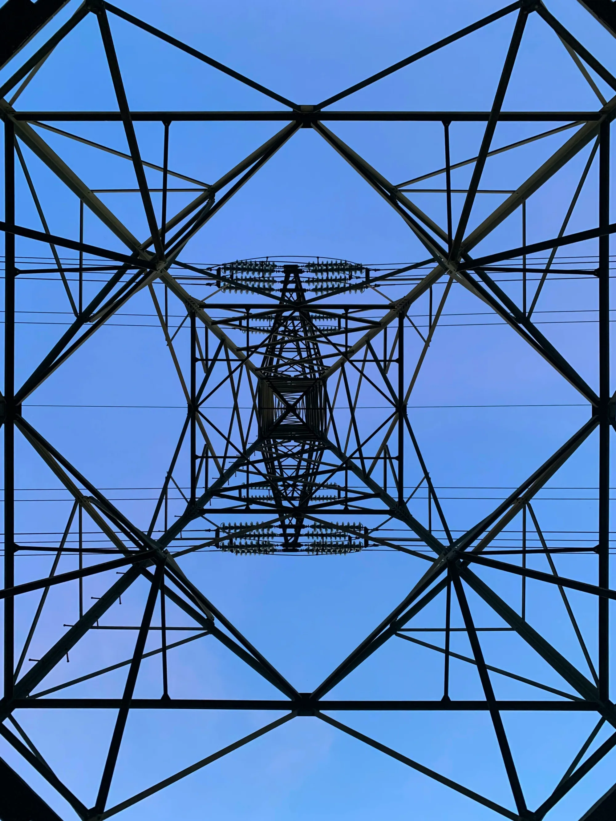 Wire tower for electricity. Architecture from below. High voltage.