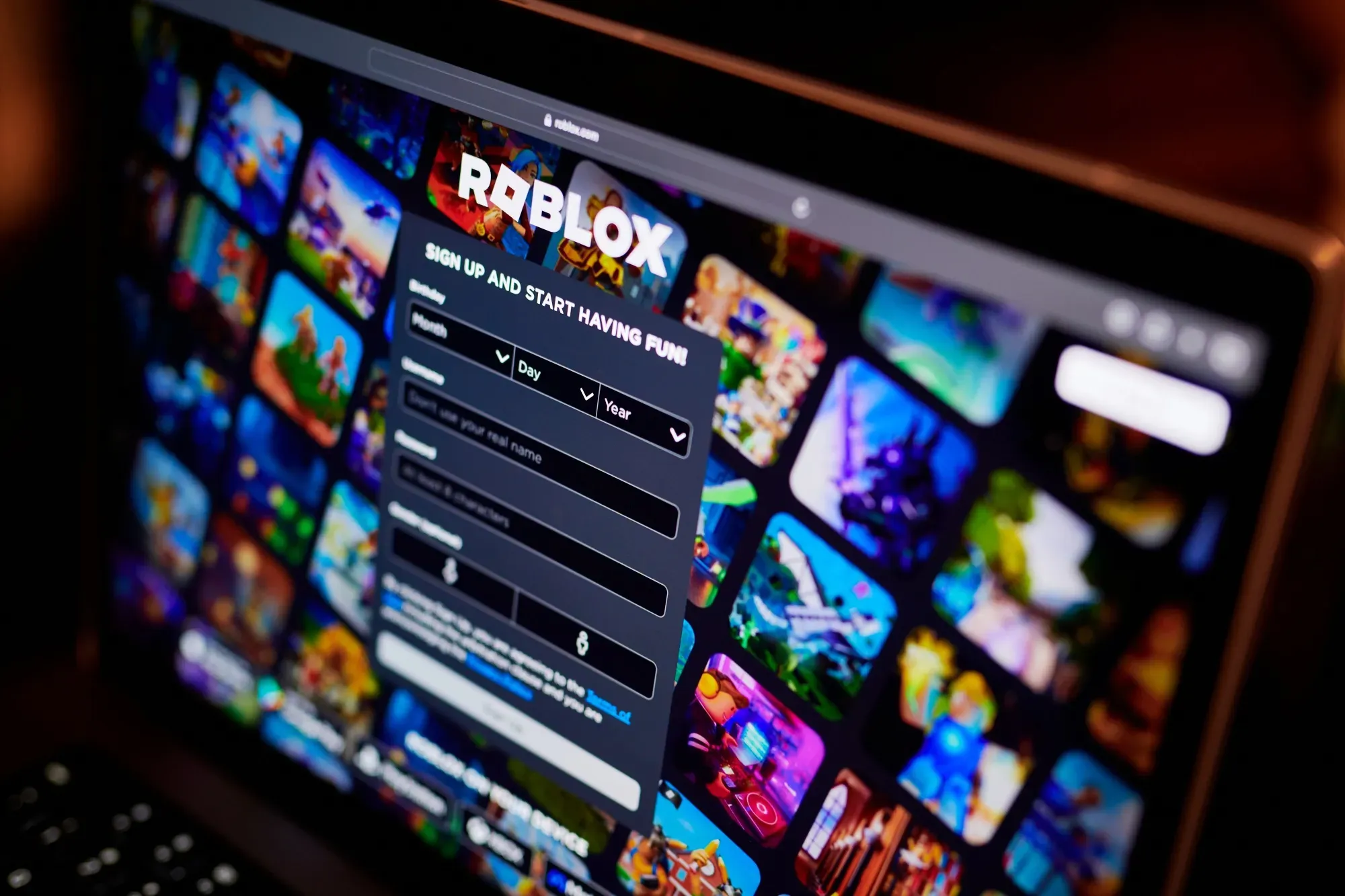The Roblox website on a laptop.