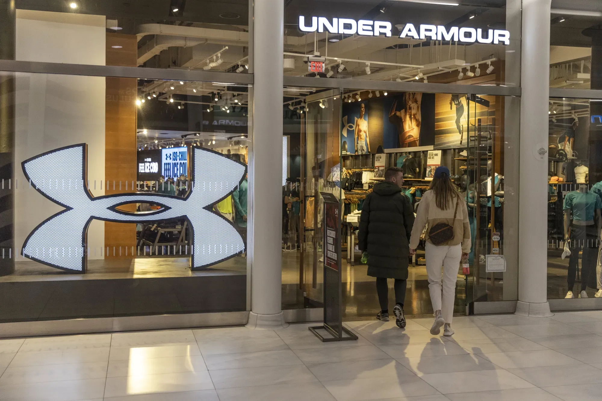 Under Armour Posts Small Profit Despite Sales Drop, Cuts Full-Year Revenue Outlook